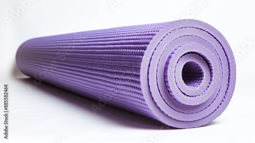 A yoga mat rolled up, highlighting its texture and flexibility. Isolate white background