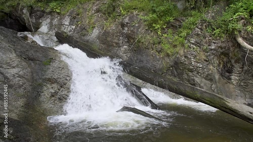 Beautiful waterfall in tropical forest in Chae Son National Park, Lampang, Thailand - slow motion