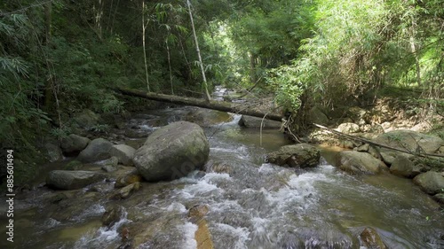Beautiful stream in tropical forest in Chae Son National Park, Lampang, Thailand