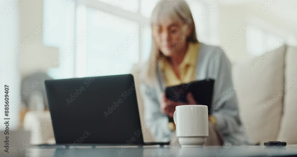 Mature woman, relax and technology with coffee cup for comfort, internet or home streaming services. Person with tea or warm beverage for planning on laptop, phone or digital tablet while watching tv Mature woman, relax and technology with coffee cup for comfort, internet or home streaming services. Person with tea or warm beverage for planning on laptop, phone or digital tablet while watching tv