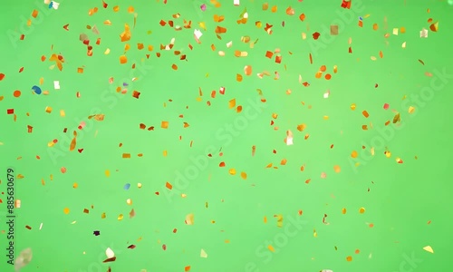 Multicolored confetti falls gracefully against a green screen background (mov)