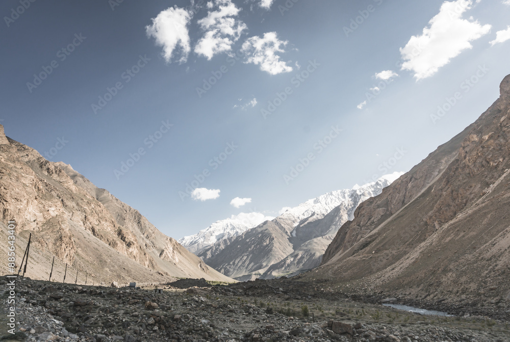 Obraz premium Panorama of mountain range of rocks with snow and glaciers in Pamir in Tajikistan mountains in cloudy weather, minimalistic landscape of high mountains for background