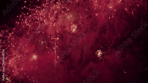 Colorful real fireworks show performance display celebration festival holiday on dark sky for abstract background, anniversary, celebration, 4th July, Independence Day, and new year.