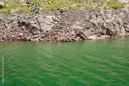 Uvac nature reserve tour with boat ride, Uvac lake, stone and green water backgrounds, Serbia