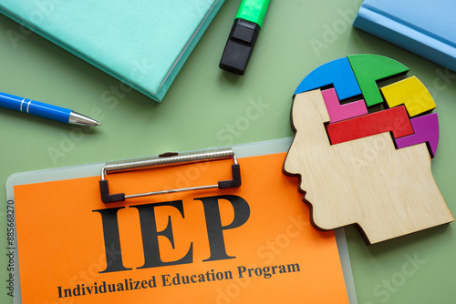 Clipboard with IEP Individualized Education Program and head model. photo