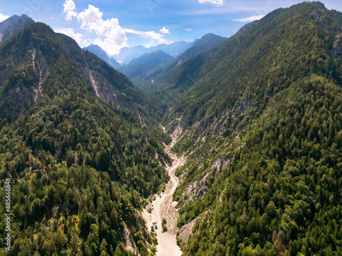 Drone view of the Alps mountains in Slovenia. mountain canyon formed by a river bed. the mountain slopes are covered with dense forest