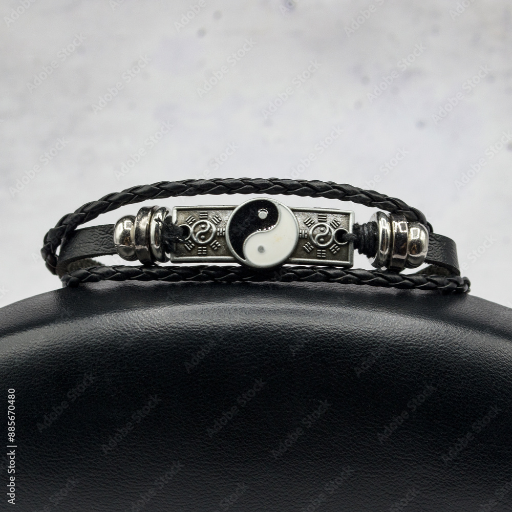 Hippie style bracelet with yin-yang sign. Interweaving of leather and threads. Hippie handmade Fashion Jewelry. Amulet for good luck. Hippie style bracelet with yin-yang sign. Interweaving of leather and threads. Hippie handmade Fashion Jewelry. Amulet for good luck.