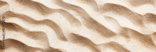 Background with clean beach sand texture top view, summer on sunny day