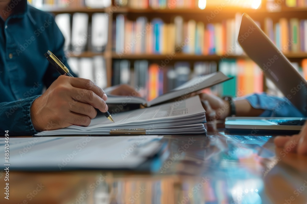 Intellectual Property Lawyers Reviewing Documents with Client in Modern Law Office Intellectual Property Lawyers Reviewing Documents with Client in Modern Law Office