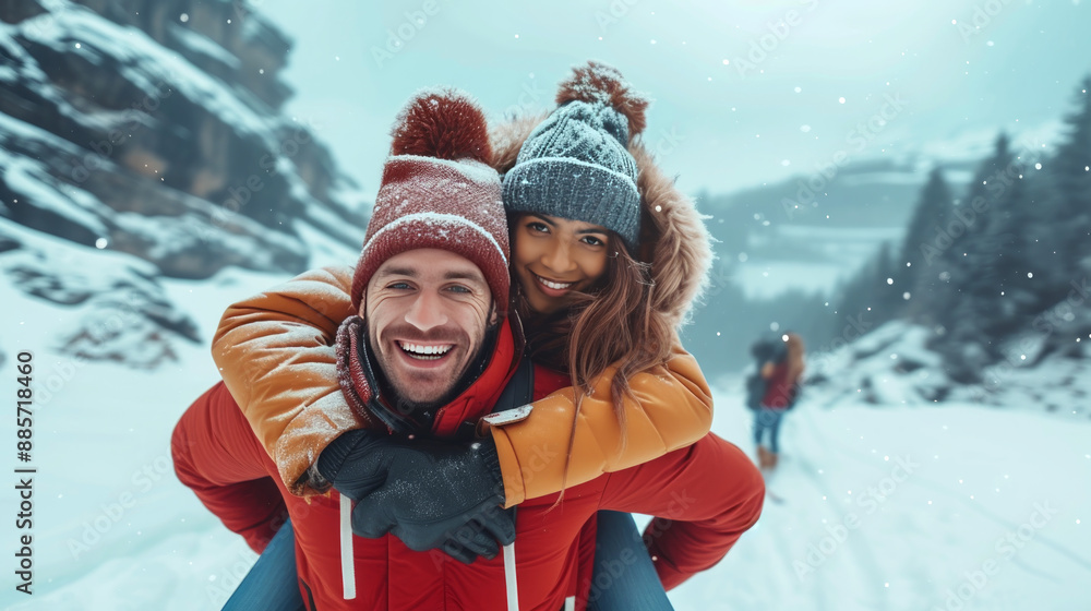 Young couple is enjoying a snowy day in the mountains Young couple is enjoying a snowy day in the mountains