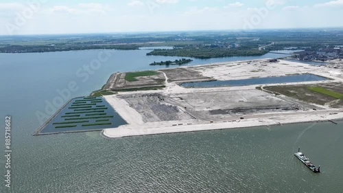 The artificially created StrandEiland under construction, nearby IJburg Amsterdam, the Netherlands from the air by helicopter photo