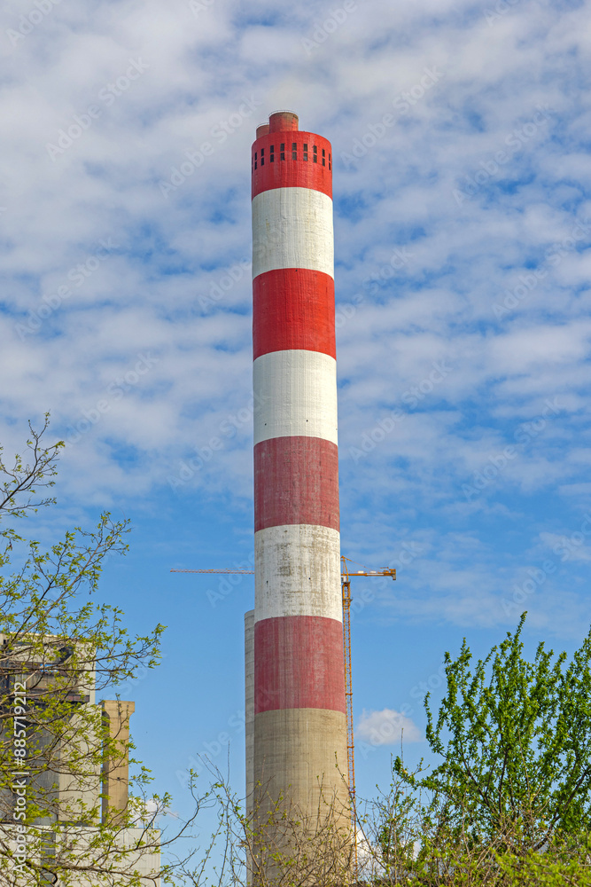 Red and White Tall Chimney at Thermal Power Plant Facility Red and White Tall Chimney at Thermal Power Plant Facility
