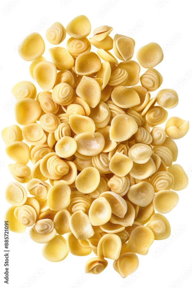 A pile of cooked pasta shells arranged on a clean white surface, ideal for food styling or still life photography A pile of cooked pasta shells arranged on a clean white surface, ideal for food styling or still life photography