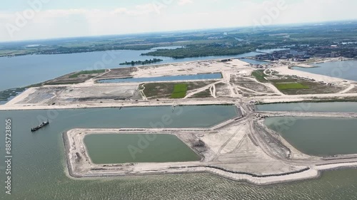 The artificially created StrandEiland under construction, nearby IJburg Amsterdam, the Netherlands from the air by helicopter photo