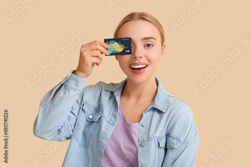 Happy young woman holding c...