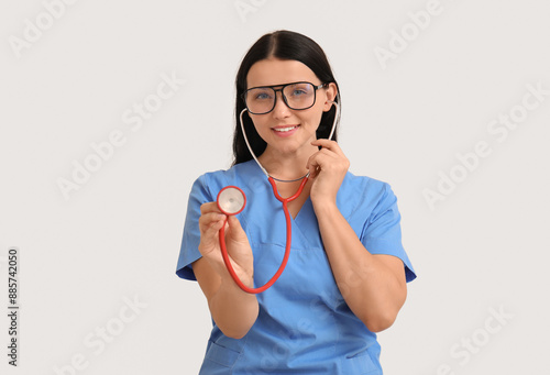 Female doctor on light back...