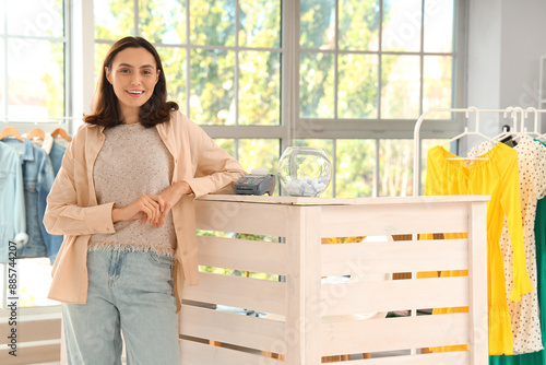 Female seller at counter in...