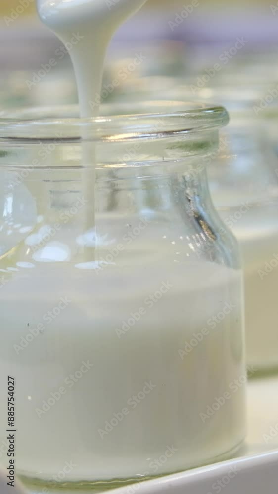 Natural yogurt cups and spoon with white background. Concept of healthy and natural food. yogurt spoon production Natural yogurt cups and spoon with white background. Concept of healthy and natural food. yogurt spoon production