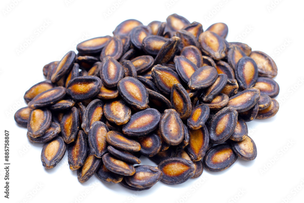 Roasted watermelon seeds on white background. Roasted watermelon seeds on white background.