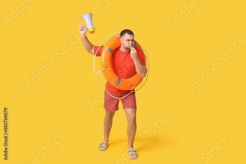 Young lifeguard with lifebu...