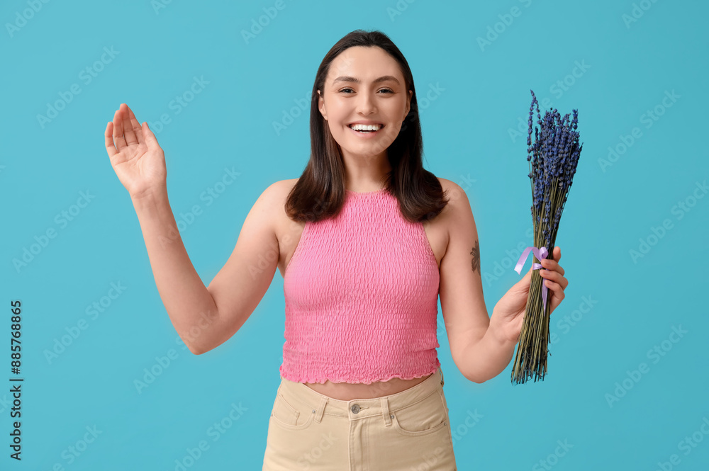 Beautiful happy young woman with bouquet of lavender flowers on blue background Beautiful happy young woman with bouquet of lavender flowers on blue background