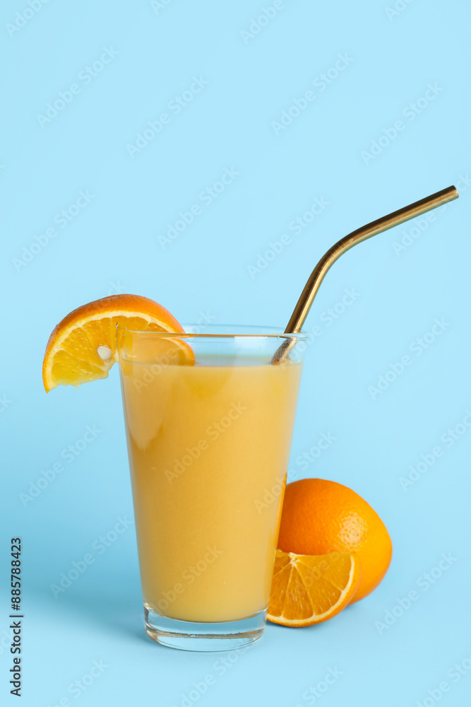Glass of healthy orange juice on light blue background Glass of healthy orange juice on light blue background