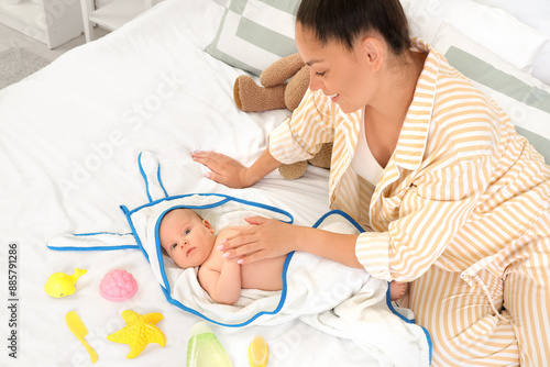 Newborn baby wrapped in a h...