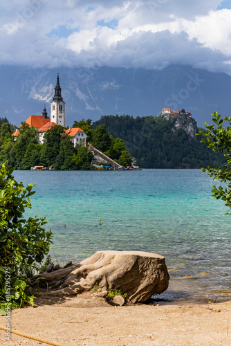 Panoramic view from Lake Bled, beauty heritage in Slovenia. Island with church and castle in the background create a dream setting. View from Ojstrica and Mala Osojnica with the heart-shaped bench. photo