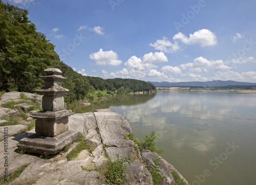 High angle view of a three-story stone pagoda on the rock against Namhan River at Silleuksa Temple near Yeoju-si, South Korea
 photo