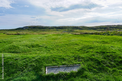 Newfoundland, Canada: A foundation marker at L’Anse-aux-Meadows (trans. Meadows Cove), the archeological site of a Norse settlement dating from 990 to 1050 CE. photo