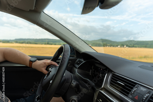 Wallpaper Mural Close up and portrait of old and retired man holding steering wheel with his hands driving and enjoying new car in the road. Satisfied client concept . High quality photo Torontodigital.ca