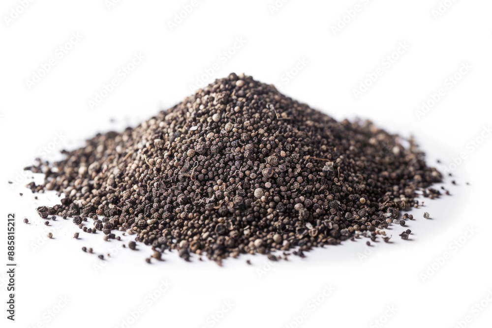 A pile of black sesame seeds on a white surface