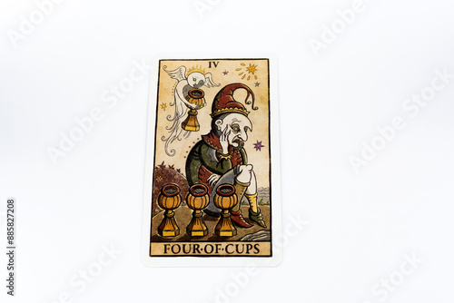 Tarot cards, Waite Rider tarot cards, the four of cups card in the foreground on a background of available deck cards
