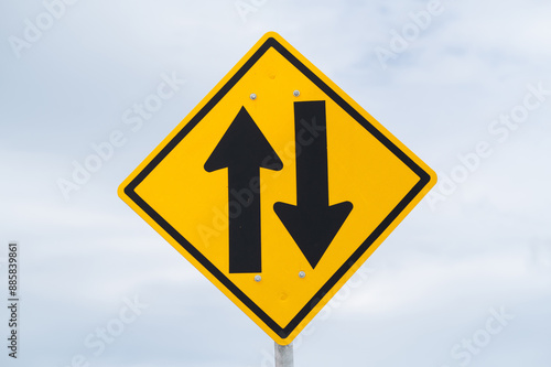 Two-way traffic ahead sign is on sky background. Free Download Two-way traffic ahead sign is on sky background. - GFXLoad