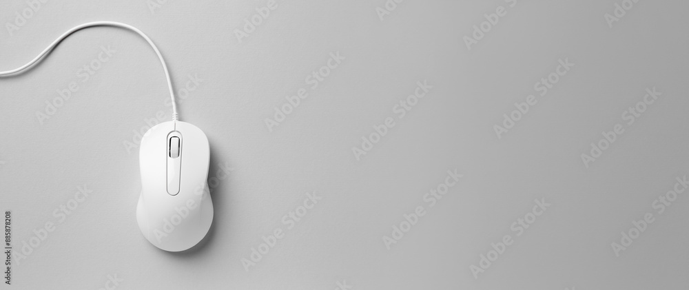 Computer mouse on light grey background, top view. Banner design with space for text Computer mouse on light grey background, top view. Banner design with space for text