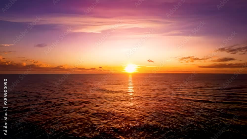 Timelapse of sunset over ocean with vibrant hues, capturing the serene beauty as the sun sets below the horizon. Timelapse of sunset over ocean with vibrant hues, capturing the serene beauty as the sun sets below the horizon.
