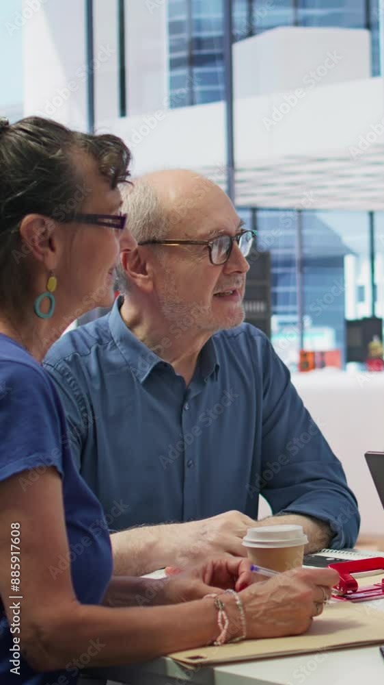 Vertical Video Elderly couple consulting with a financial advisor to create a detailed retirement plan, focusing on savings, investments and ensuring a comfortable future. Life insurance and finances Vertical Video Elderly couple consulting with a financial advisor to create a detailed retirement plan, focusing on savings, investments and ensuring a comfortable future. Life insurance and finances