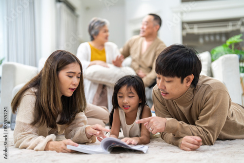 Portrait happy love asian family mother teach little daughter asian girl learn and study on table.Mom and asian young girl read with book and pencil making lessons in homeschool at home.Education