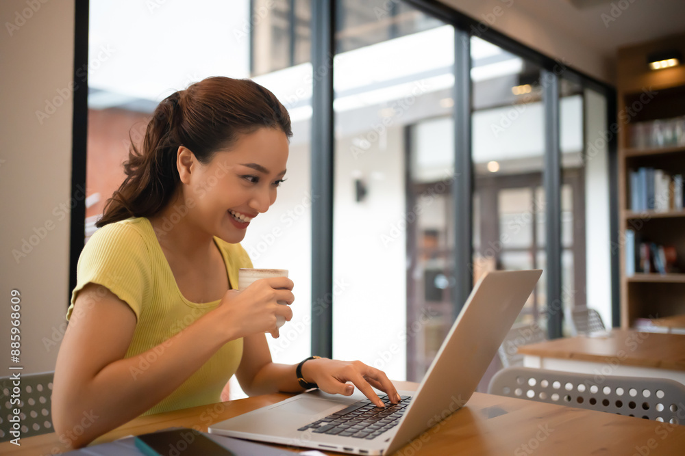 Woman sitting working with laptop at coffee shop, freelance woman working outside Concept. Woman sitting working with laptop at coffee shop, freelance woman working outside Concept.