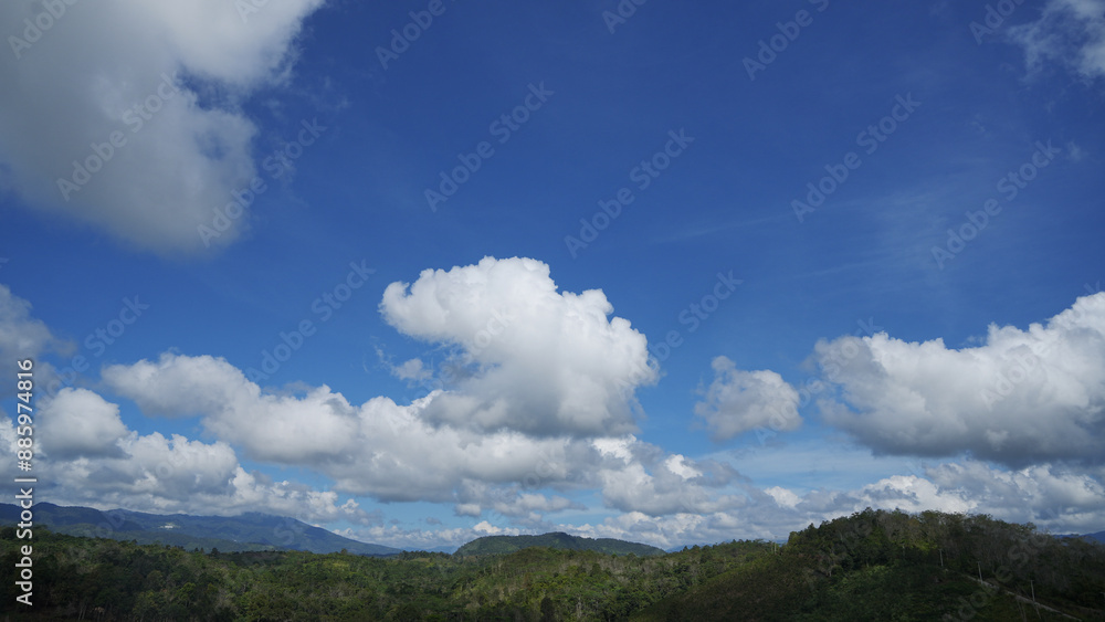 beautiful landscapes bue sky with white cloud, with hills, mountain and forest. at Talang Barisan village, Muara Enim, South Sumatera, Indonesia beautiful landscapes bue sky with white cloud, with hills, mountain and forest. at Talang Barisan village, Muara Enim, South Sumatera, Indonesia