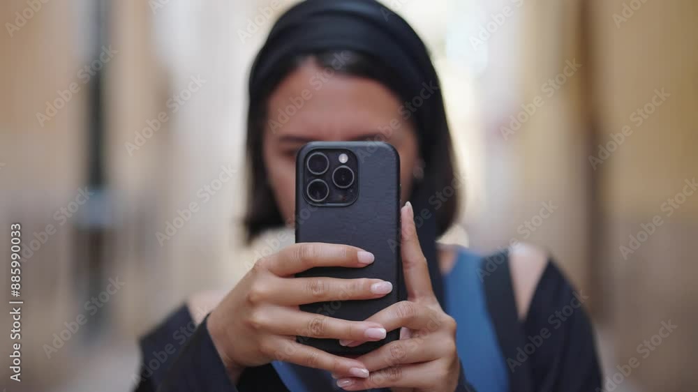 Caucasian female tourist in Mallorca hold smartphone and take photos Caucasian female tourist in Mallorca hold smartphone and take photos