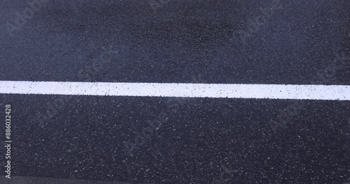 Wallpaper Mural A slow motion of raindrop at the asphalt street in the downtown Torontodigital.ca