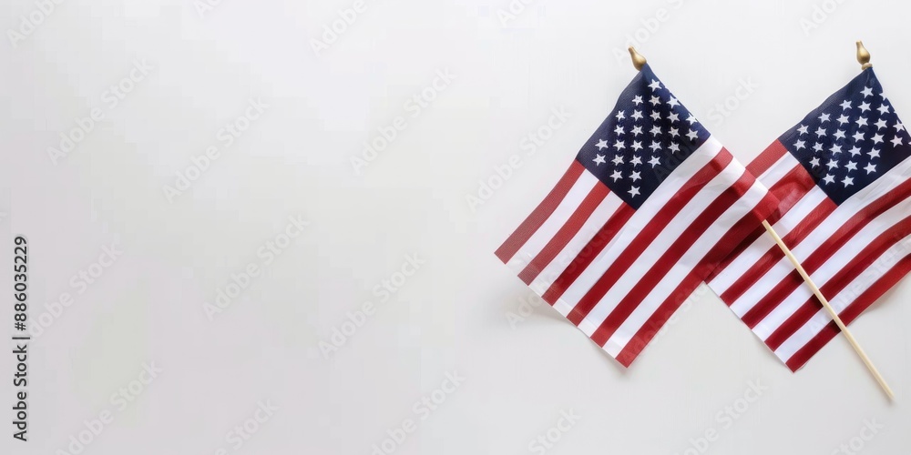 Obraz premium American flags against white background. Flat lay with copy space. Happy Labor Day or 4th july concept.