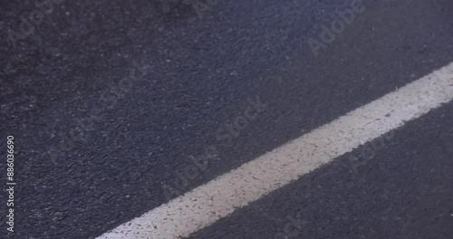 Wallpaper Mural A slow motion of raindrop at the asphalt street in the downtown Torontodigital.ca