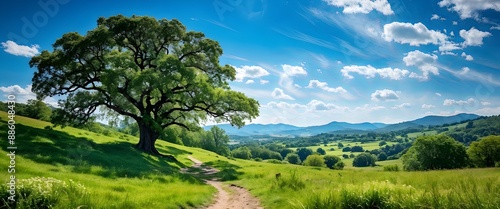 Majestic oak tree under clear blue sky with mountain landscape in background. Generative AI