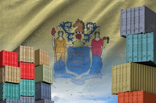 New Jersey US state flag and big stack of shipping cargo containers in docks with sky background close up photo