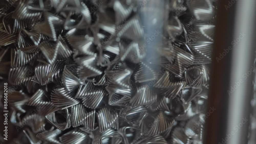 Macro of small metal spirals that are in a glass vessel Macro of small metal spirals that are in a glass vessel