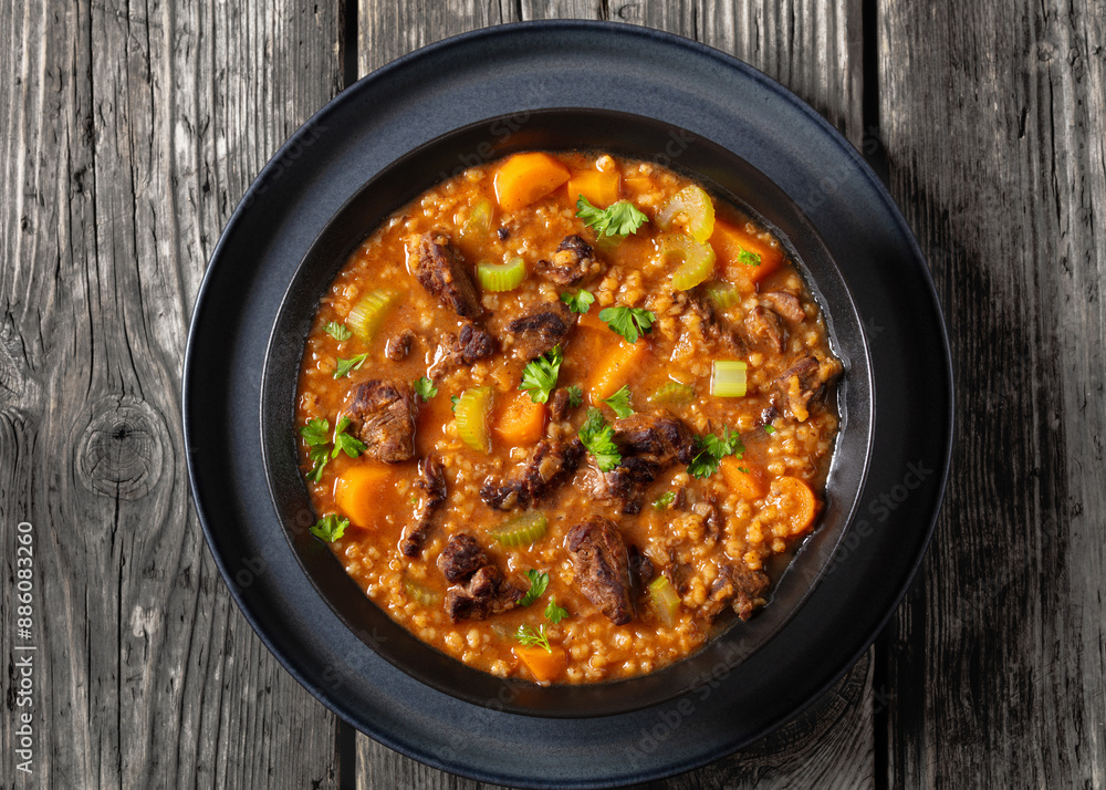 beef barley soup in a bowl, top view beef barley soup in a bowl, top view
