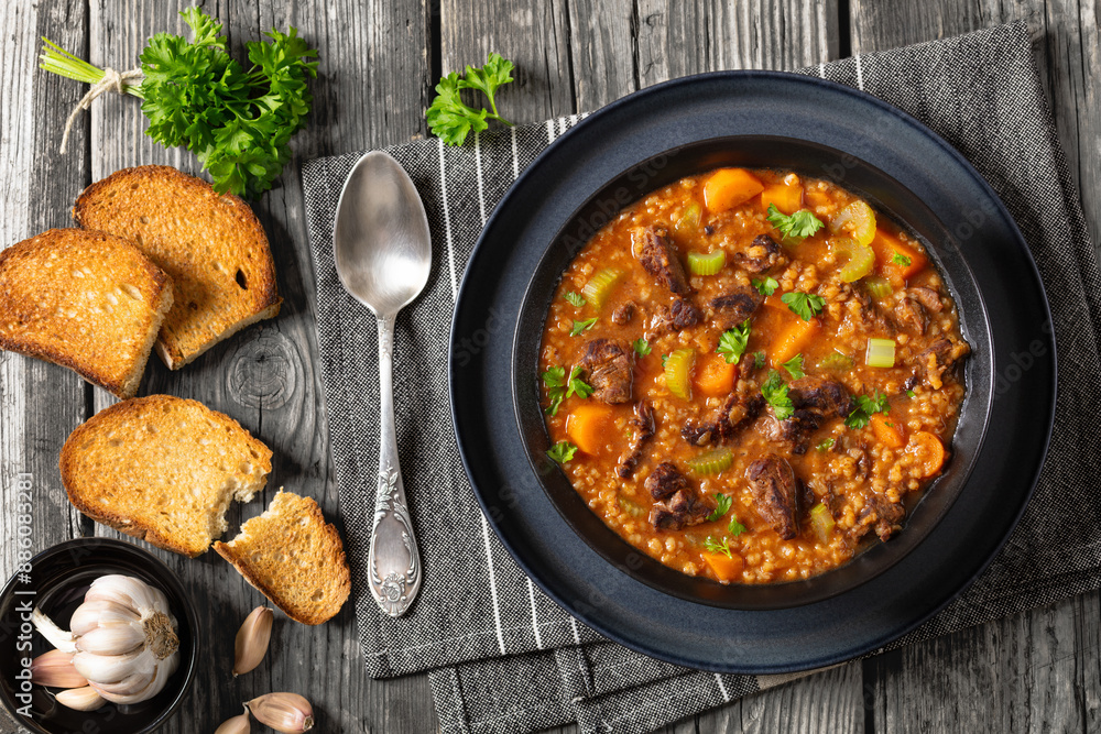 beef barley soup in a bowl, top view beef barley soup in a bowl, top view