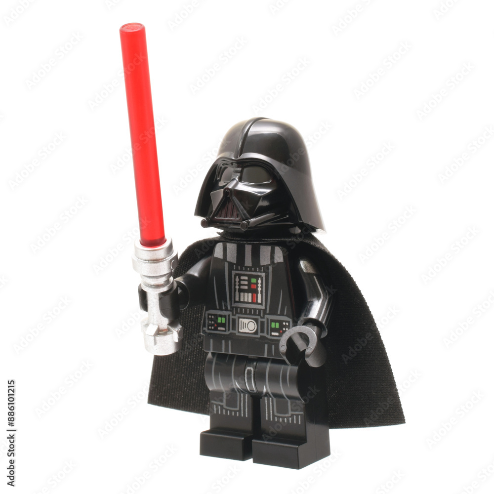 Obraz premium Lego minifigure of Darth Vader from Star Wars with lightning sword isolated on white. Editorial illustrative image of popular plastic constructor and 25 Anniversary.